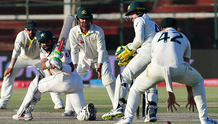 Pakistans wicketkeeper Mohammad Rizwan (2L) plays a shot during the fifth and final day of the second Test cricket match between Pakistan and Australia at the National Cricket Stadium in Karachi on March 16, 2022. — AFP