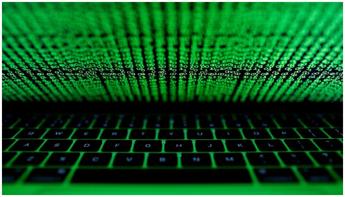A computer keyboard lit by a displayed cyber code is seen in this illustration picture taken on March 1, 2017. Photo: Reuters/ file