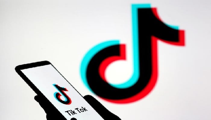 A person holds a smartphone with the TikTok logo displayed in this picture illustration taken Nov. 7, 2019. &mdash; Reuters/File