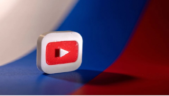Youtube logo is placed on a Russian flag in this illustration picture taken February 26, 2022. —Reuters/Dado Ruvic/Illustration