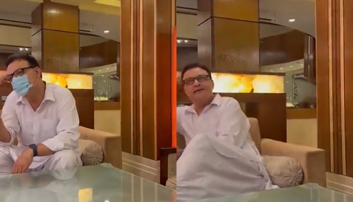 PTI MNA Noor Alam Khan speaks to two people — reportedly belonging to the PTI — at an Islamabad hotel. — Twitter/@UsmanPAK007