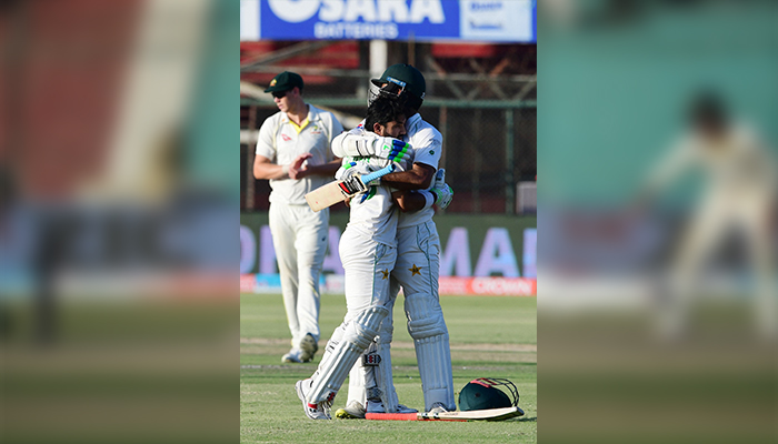 Pakistans Mohammad Rizwan (L) and Pakistans Nauman Ali embrace during the fifth and final day of the second Test cricket match between Pakistan and Australia at the National Cricket Stadium in Karachi on March 16, 2022. — AFP