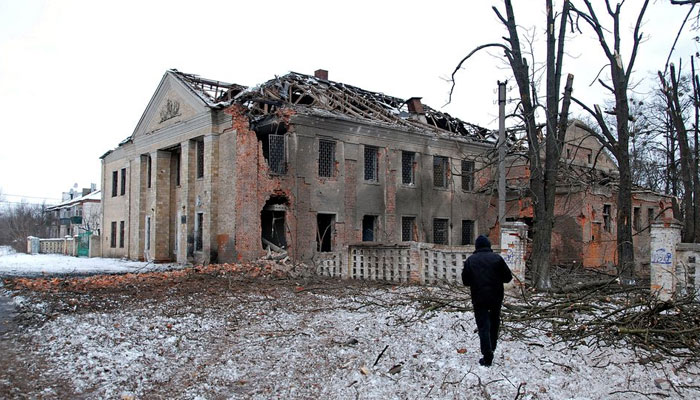 A man walks in front of a building damaged by recent shelling during Ukraine-Russia conflict in Kharkiv, Ukraine on March 6, 2022. — Reuters/File