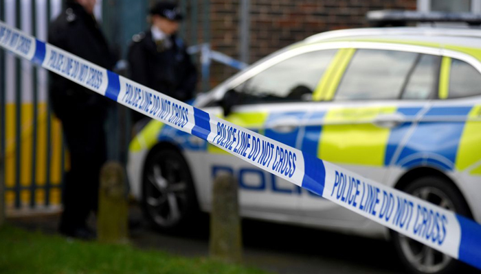Police officers stand outside the scene of a fatal stabbing as British police said they were investigating at least five separate serious violent incidents in south London late on Friday, Croydon, London, Britain, February 6, 2021. — Reuters