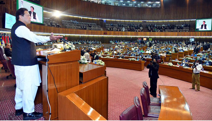 Prime Minister Imran Khan addressing the 48th Ogranization of Islamic Cooperation conference at Parliament House, Islamabad on March 22, 2022. — PID