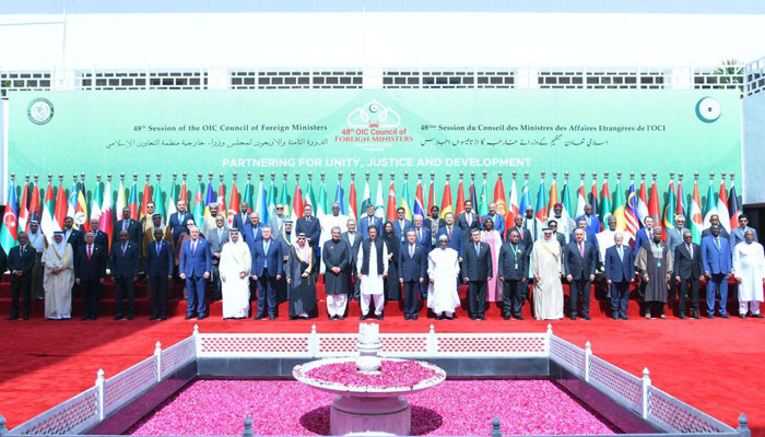 A group picture of Prime Minister Imran Khan and the OIC Delegates at the 48th Session of the OIC Council of Foreign Ministers. — Twitter/PakPMO
