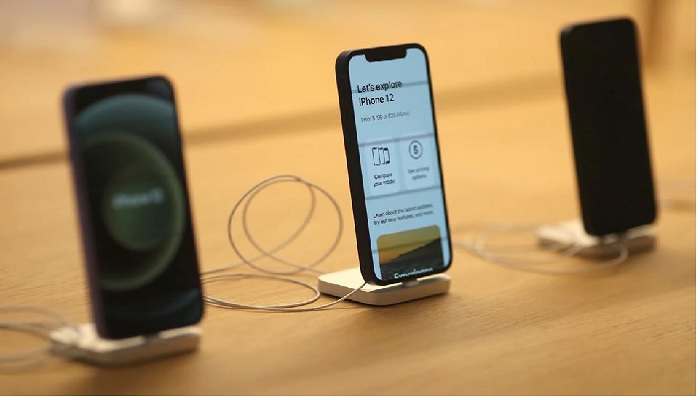 IPhone 12 phones are seen at the new Apple Store on Broadway in downtown Los Angeles, California, U.S., June 24, 2021. Reuters