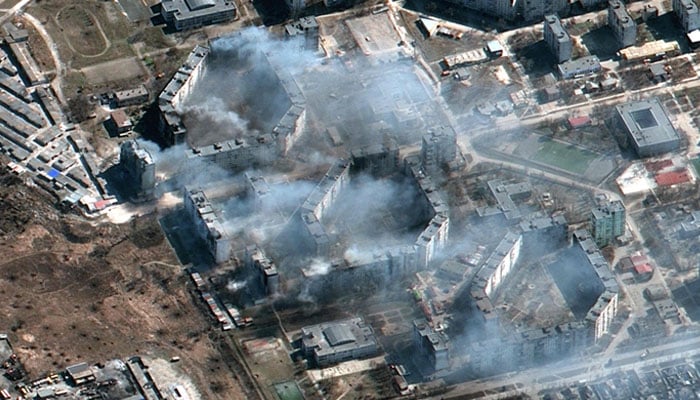 This Maxar satellite image taken on March 19, 2022 and released on March 21, 2022 shows burning apar. Photo— AFP