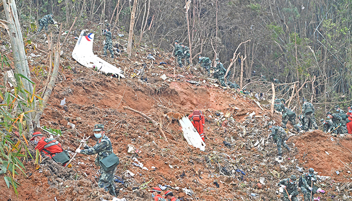 Rescuers search for the black boxes at a plane crash site in Tengxian county of Wuzhou, Guangxi Zhuang Autonomous Region, China March 22, 2022. — Reuters