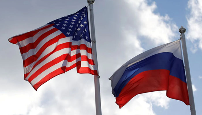 Russia expels US diplomats in tit-for-tat move 2 Russian and U.S. state flags fly near a factory of Ford Sollers, a joint venture of U.S. carmaker Ford with Russian partners, in Vsevolozhsk, Leningrad Region. Photo— REUTERS/Anton Vaganov