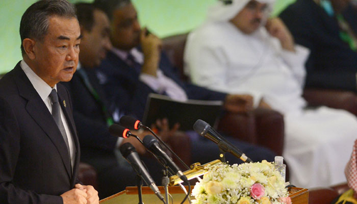 Chinese Foreign minister Wang Yi (L) speaks during the 48th session of the Organization of Islamic Cooperation (OIC) Council of Foreign Ministers, in Islamabad on March 22, 2022. — AFP/File