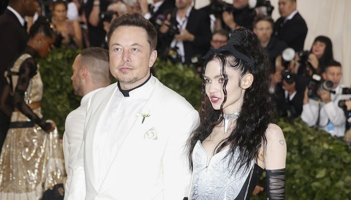 Elon Musk and Grimes arrive at the Metropolitan Museum of Art Costume Institute Gala (Met Gala) to celebrate the opening of “Heavenly Bodies: Fashion and the Catholic Imagination” in the Manhattan borough of New York, U.S., May 7, 2018. —Reuters