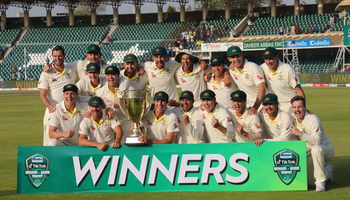 Australian team posing with the trophy after claiming the historic Test series against Pakistan on March 25, 2022 at Gaddafi Stadium Lahore. — Twitter/TheRealPCB