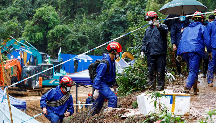 Rescue workers work at the site where a China Eastern Airlines Boeing 737-800 plane flying from Kunming to Guangzhou crashed, in Wuzhou, Guangxi Zhuang Autonomous Region, China March 24, 2022. — Reuters