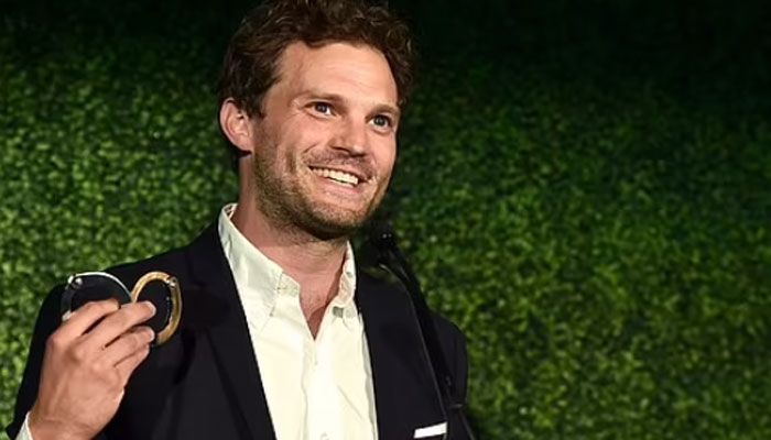 Jamie Dornan makes racy Fifty Shades of Grey during Oscar Wilde Awards