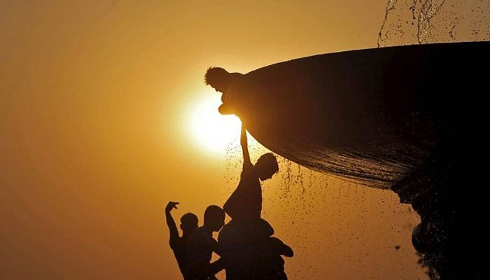 Children playing under the sun. — Reuters/File