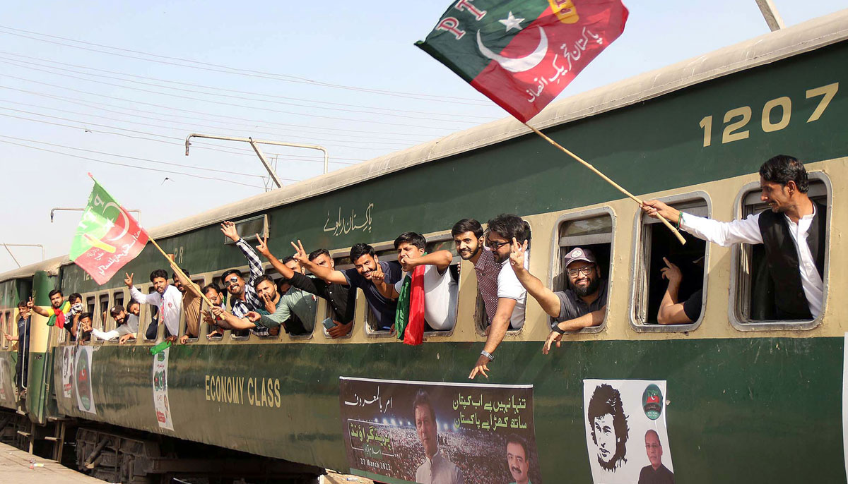 Supporters of PTI shout slogans during the train march from Karachi to Islamabad as PTI called their supporters from across the country to gather in Islamabad on March 27 for its grand public gathering. — Online