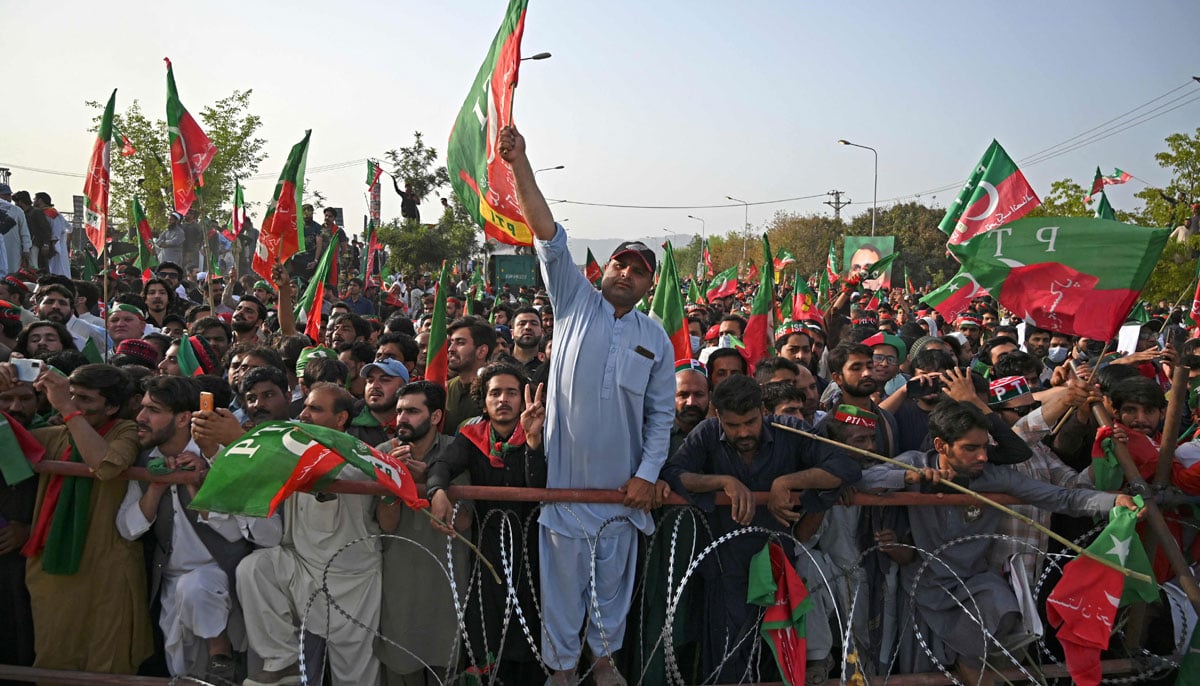 Supporters of ruling PTI party attend a rally being addressed by Pakistans Prime Minister Imran Khan, in Islamabad on March 27, 2022. — AFP