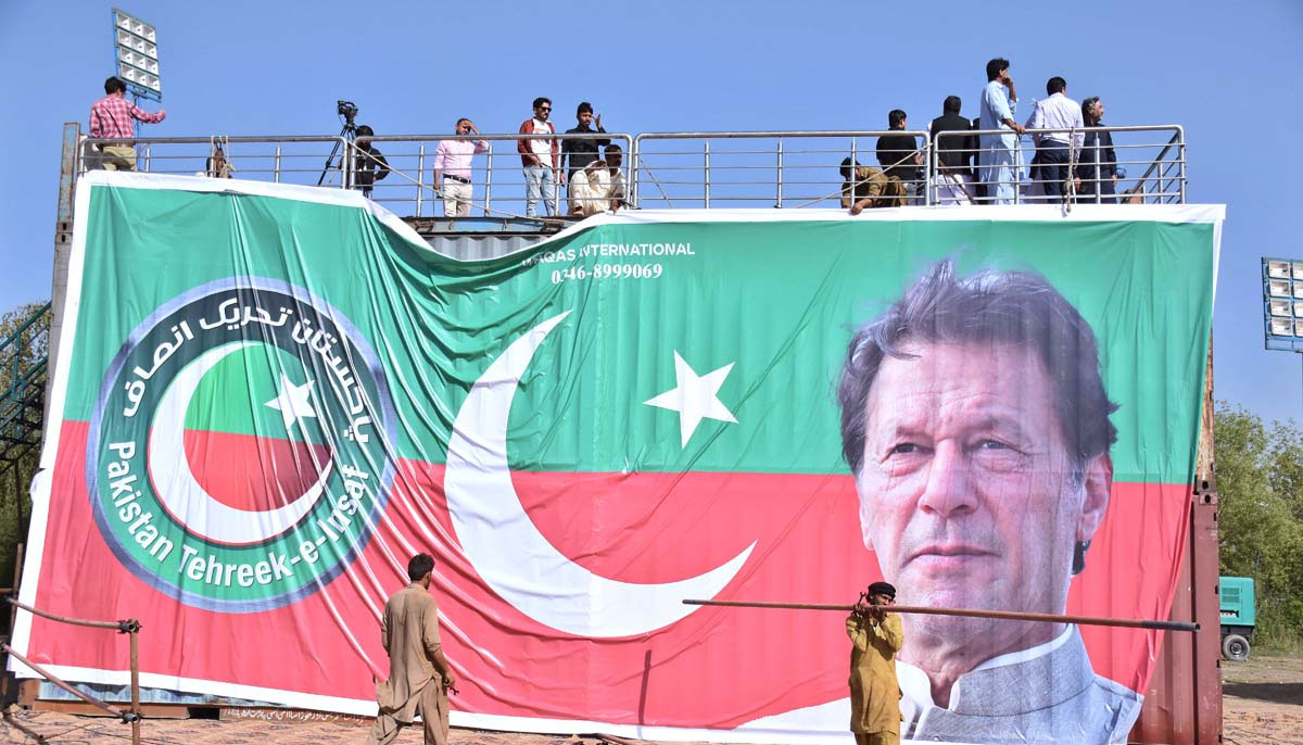 Workers of PTI preparing stage for the public meeting of Prime Minister Imran Khan at Parade Ground in the federal capital. — APP