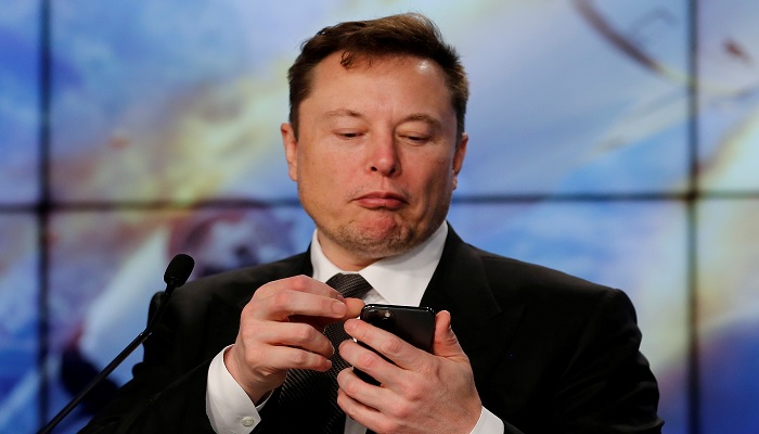 SpaceX founder and chief engineer Elon Musk looks at his mobile phone during a post-launch news conference to discuss the SpaceX Crew Dragon astronaut capsule in-flight abort test at the Kennedy Space Center in Cape Canaveral, Florida, U.S. January 19, 2020.—Reuters