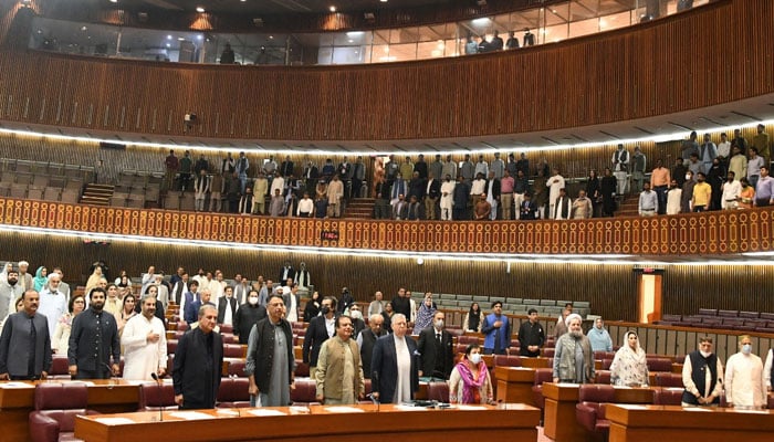 A picture of PTI leaders standing in the National Assembly for the national anthem on March 25, 2022. — Twitter/NAofPakistan