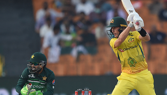 Australias Marnus Labuschagne (R) plays a shot as Pakistans wicketkeeper Mohammad Rizwan watches during the first one-day international (ODI) cricket match between Pakistan and Australia at the Gaddafi Cricket Stadium in Lahore on March 29, 2022. — AFP