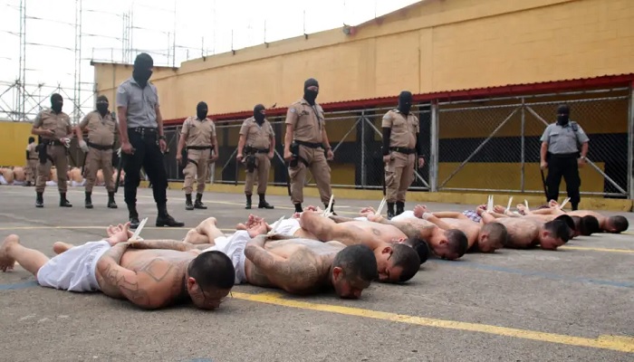 Gang members are forced to lie face-down. —AFP