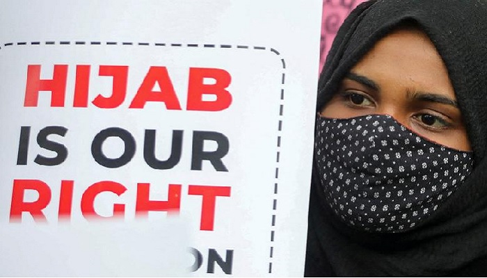 A student holds a placard during a protest by Muslim Students Federation against the recent hijab ban in few of Karnataka’s colleges, in New Delhi, India, February 8, 2022. —Reuters