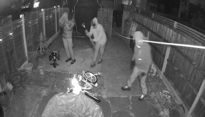 Security cameras recorded the robbers entering with a sledgehammer.— Screengrab from YouTube/Manchester Evening News