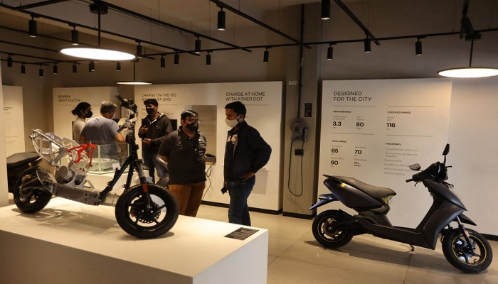 People look at electric scooters inside the Ather showroom in Mumbai, India, January 28, 2022. —Reuters