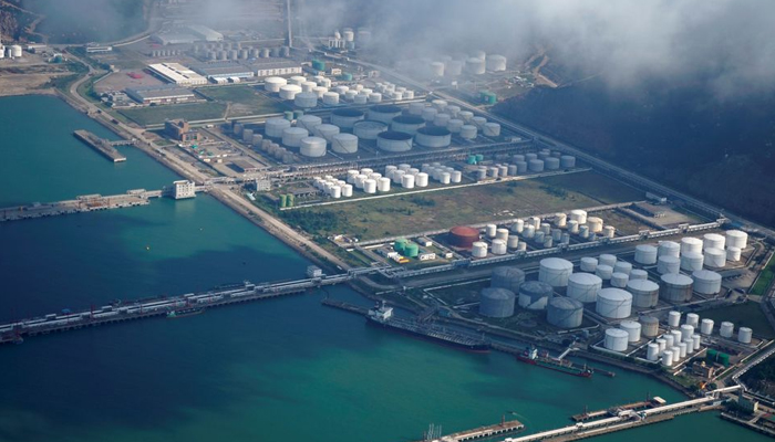 Oil and gas tanks are seen at an oil warehouse at a port in Zhuhai, China October 22, 2018. — Reuters