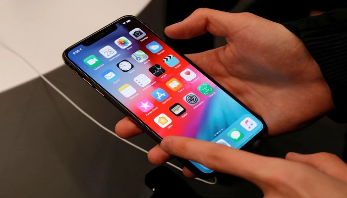 A customer tests a smartphone during the launch of the new iPhone XS and XS Max sales at re:Store Apple reseller shop in Moscow, Russia September 28, 2018. —Reuters