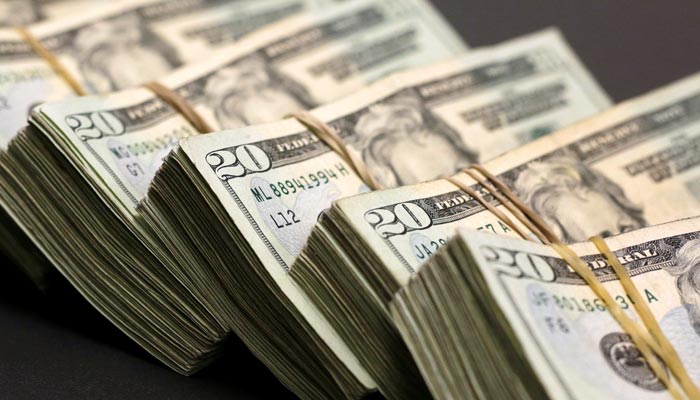 Bundles of banknotes of US Dollar are pictured at a currency exchange shop. — Reuters/File