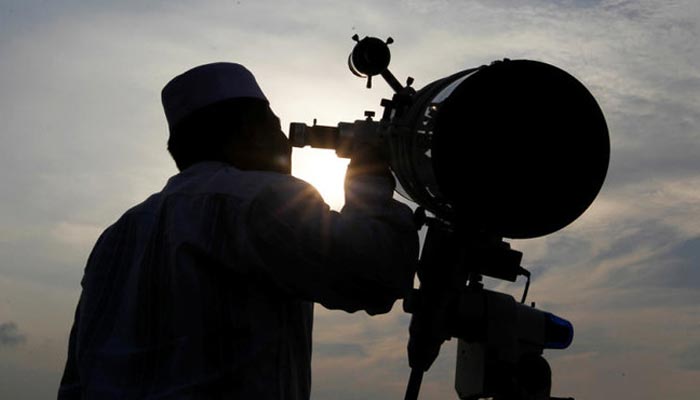 A Muslim man uses a telescope to observe the moon before the holy month of Ramadan at Al-Musyariin mosque in Jakarta, Indonesia. — Reuters/File