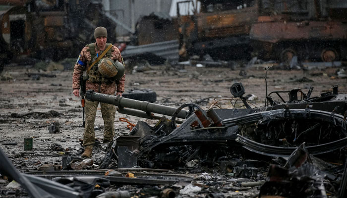 A Ukrainian service member inspects a compound of the Antonov airfield, as Russias attack on Ukraine continues, in the settlement of Hostomel, in Kyiv region, Ukraine April 3, 2022. Photo— REUTERS/Gleb Garanich