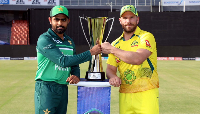 Pakistan Cricket Team Captain Babar Azam and Captain Australian Cricket Team Aaron Finch pose with the ODI Series Trophy during the unveiling ceremony held at Gaddafi Stadium in Lahore on Monday, March 28, 2022. — PPI/File