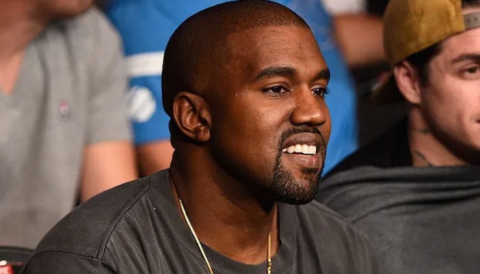 Kanye West is all smiles after dropping out of Coachella