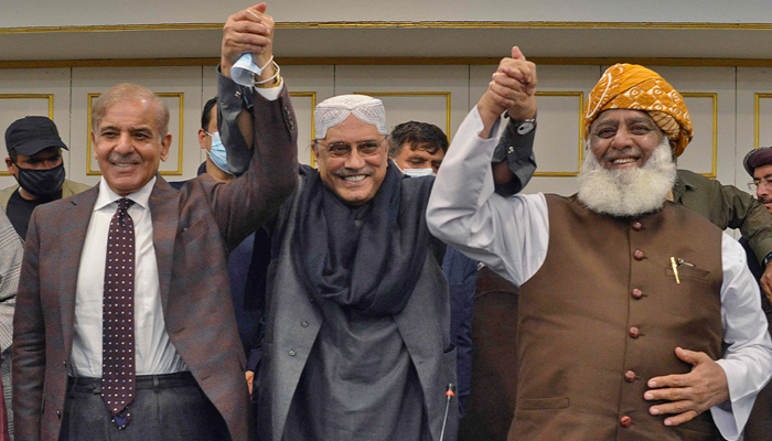 Pakistani opposition leaders, Shahbaz Sharif (L), Asif Ali Zardari (C), former President and leader of Pakistan Peoples Party, and Fazlur Rehman (R), head of JUI-F, gesture during a press conference in Islamabad on March 8, 2022. — AFP/File