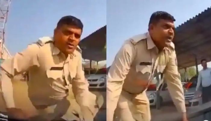 Cop in India dragged against car bonnet by Aam Admi Party leader. — Screengrab from Twitter video/MyVadodara