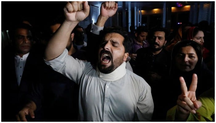 Supporters of former Pakistani Prime Minister Imran Khan chant slogans as they protest after he lost a confidence vote in the lower house of parliament, in Islamabad, Pakistan April 10, 2022. — Reuters