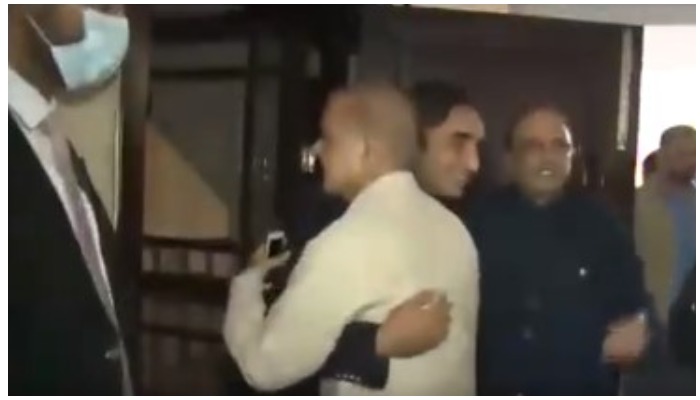 PML-N President Shahbaz Sharif embraces PPP Chairman Bilawal Bhutto-Zardari, while PPP Co-chairman Asif Ali Zardari stand in the background to welcome the PML-N delegation at the Bilawal House