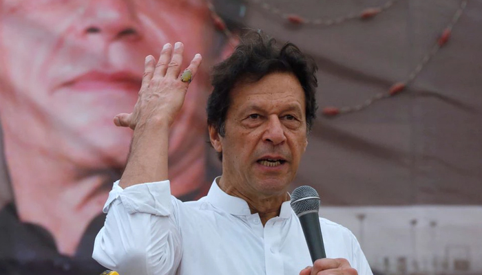 Imran Khan, chairman of the Pakistan Tehreek-e-Insaf (PTI), gestures while addressing his supporters during a campaign meeting ahead of general elections in Karachi, Pakistan, July 4, 2018. — Reuters