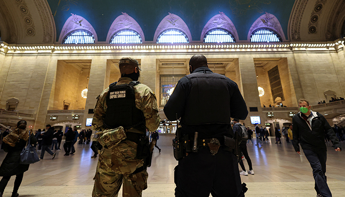A member of the National Guard and a New York Transit Police officer monitor the Grand Central Terminal in Manhattan, New York City, New York, US, on April 12, 2022. — Reuters