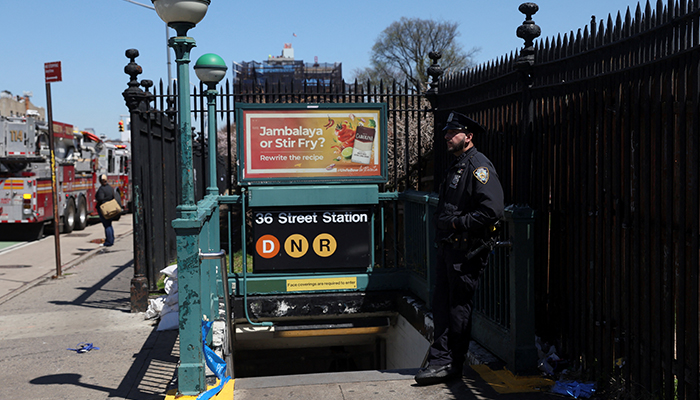 A police officer stands next to the entrance to the subway station, the scene of a shooting, in the Brooklyn borough of New York City, New York, US, on April 12, 2022. — Reuters