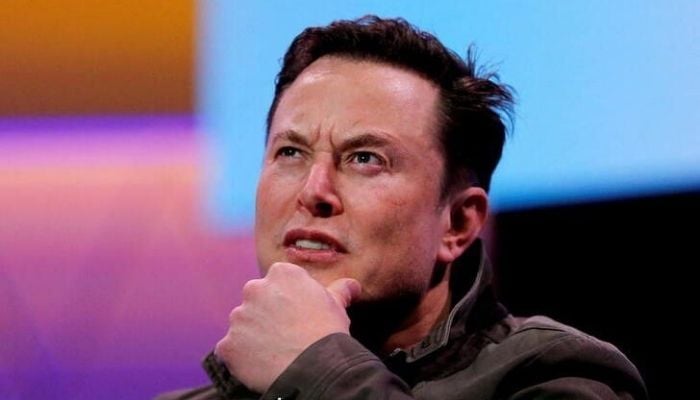 Elon Musk gestures during a conversation. Reuters