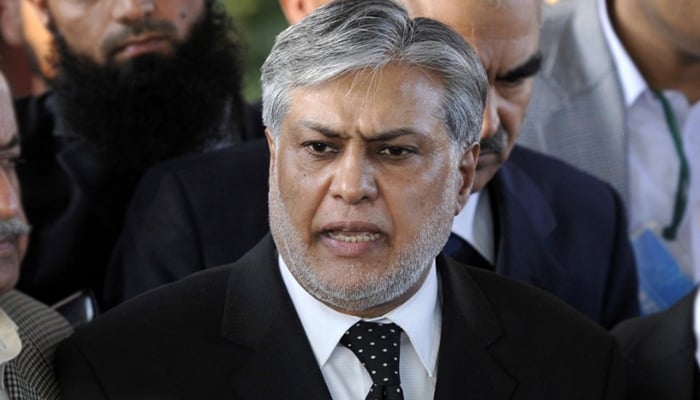 In this file photo, PML-N leader and former finance minister Ishaq Dar speaks to the media. — AFP