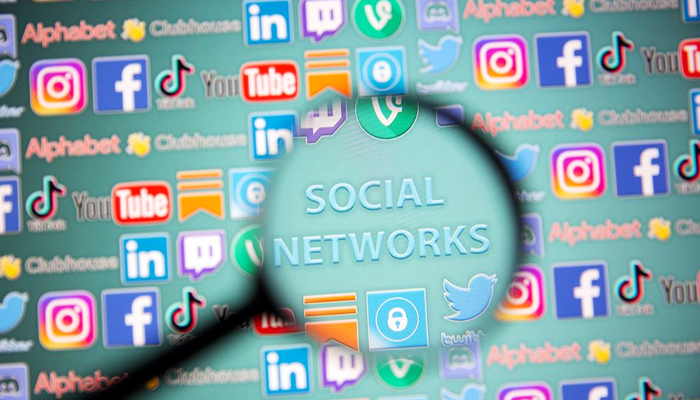 Social network words and social media logos are seen through magnifiers displayed in this illustration taken, on May 25, 2021.  — Reuters
