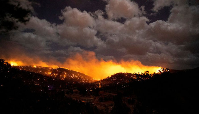 The McBride Fire burns in the heart of the village in Ruidoso, New Mexico, United States, April 12, 2022. Photo— Ivan Pierre Aguirre/USA Today Network via REUTERS