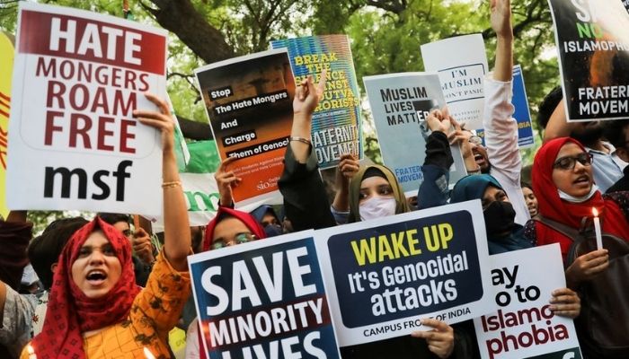 Citizens shout slogans and hold placards during a peace vigil organised by citizens against what they say is rise in hate crimes and violence against Muslims in the country, in New Delhi, India, April 16, 2022. — Reuters