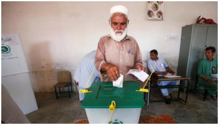 A voter casts his vote at a polling station in Pakistan. — Reuters/ file